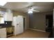 Open kitchen with tile floors, white cabinets, neutral wall paint and standard appliances at 8334 N 55Th Ave, Glendale, AZ 85302