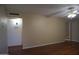 Spacious living room with new hardwood floors, neutral paint and updated ceiling fan at 8334 N 55Th Ave, Glendale, AZ 85302