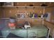Interior view of the shed, featuring storage shelves and a work bench at 8334 N 55Th Ave, Glendale, AZ 85302