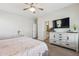 Relaxing bedroom with a bed, a dresser, windows, and an en-suite bathroom at 897 E Cherry Hills Dr, Chandler, AZ 85249