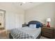 Relaxing bedroom with a comfortable bed, neutral decor, and a closet at 897 E Cherry Hills Dr, Chandler, AZ 85249