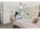 Comfortable bedroom with a dresser, a bed, windows, and a view of an en-suite bathroom at 897 E Cherry Hills Dr, Chandler, AZ 85249