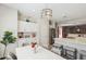 Charming dining area featuring modern decor, stylish lighting, and a seamless transition to the kitchen and living spaces at 897 E Cherry Hills Dr, Chandler, AZ 85249