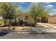 Quaint exterior view with desert landscaping highlighting the home's cozy curb appeal and charming architectural details at 897 E Cherry Hills Dr, Chandler, AZ 85249