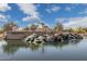 Stunning water feature at Lagos Vistoso with waterfall flowing into a lake at 897 E Cherry Hills Dr, Chandler, AZ 85249