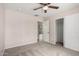 Comfortable bedroom with carpet, ceiling fan, and closet; perfect for relaxing after a long day at 9803 N 40Th Dr, Phoenix, AZ 85051