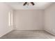 Carpeted bedroom with ceiling fan and narrow windows, ready for personalization at 9803 N 40Th Dr, Phoenix, AZ 85051