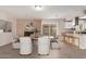 Elegant dining area with a brick fireplace, bar seating and a sliding glass door at 9803 N 40Th Dr, Phoenix, AZ 85051
