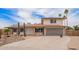 Inviting front elevation view of home with two-car garage and drought-tolerant landscaping at 9803 N 40Th Dr, Phoenix, AZ 85051