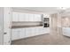 Bright kitchen features white cabinetry, stainless appliances, and lots of counter space at 9803 N 40Th Dr, Phoenix, AZ 85051
