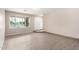 Bright living room featuring modern floors and a large window with neighborhood views at 9803 N 40Th Dr, Phoenix, AZ 85051