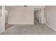 Spacious, carpeted living room with access to other rooms in the home at 9803 N 40Th Dr, Phoenix, AZ 85051
