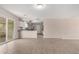 Open living space connects to the kitchen with stainless appliances and a breakfast bar for casual dining at 9803 N 40Th Dr, Phoenix, AZ 85051