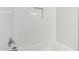 Bright shower with sleek white subway tiles, niche, and modern fixtures at 9803 N 40Th Dr, Phoenix, AZ 85051