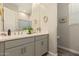 Modern bathroom featuring a double sink vanity, white counter tops, and an inviting mirror at 10447 W Salter Dr, Peoria, AZ 85382