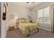 Inviting bedroom with a plush bed, classic lamps, and soft window light at 10447 W Salter Dr, Peoria, AZ 85382