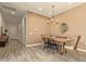 Inviting dining room featuring stylish lighting and neutral decor at 10447 W Salter Dr, Peoria, AZ 85382