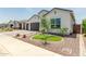 Inviting home featuring a landscaped front yard with desert accents at 10447 W Salter Dr, Peoria, AZ 85382