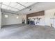 Spacious garage with ample storage, secure cabinets, and plenty of open parking space at 10447 W Salter Dr, Peoria, AZ 85382