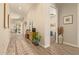 Elegant hallway featuring wood-look tile flooring and tasteful decor at 10447 W Salter Dr, Peoria, AZ 85382