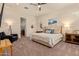 Relaxing main bedroom with plush carpet, a ceiling fan, comfortable furnishings, and serene decor at 10447 W Salter Dr, Peoria, AZ 85382