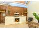 Outdoor kitchen featuring a pizza oven, wooden privacy screen, and stylish decor at 10447 W Salter Dr, Peoria, AZ 85382