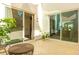Inviting outdoor patio with tiled flooring, sliding glass doors, and wicker table with ample natural light at 10447 W Salter Dr, Peoria, AZ 85382