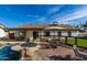 Backyard features a pool, dog run, patio, table with chairs and plenty of space for entertaining at 13918 N 78Th Ave, Peoria, AZ 85381