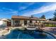 Resort-style backyard boasts a pool, covered patio, and multiple seating areas for entertaining at 13918 N 78Th Ave, Peoria, AZ 85381