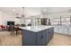 Open concept kitchen and living area with stainless steel appliances, an island and lots of light at 13918 N 78Th Ave, Peoria, AZ 85381