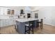 Spacious kitchen with large island, stainless steel appliances, custom cabinets, and modern lighting at 13918 N 78Th Ave, Peoria, AZ 85381