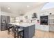 Well-designed kitchen features a large island with seating, stainless steel appliances and custom cabinetry at 13918 N 78Th Ave, Peoria, AZ 85381