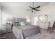 Spacious main bedroom features carpeted floors, ceiling fan, and neutral decor at 13918 N 78Th Ave, Peoria, AZ 85381