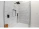 Shower features white marble-look tiling, niche, black fixtures, and a glass enclosure at 13918 N 78Th Ave, Peoria, AZ 85381