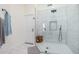 Bathroom has a shower with marble-look tile, black hardware, and a niche for toiletries at 13918 N 78Th Ave, Peoria, AZ 85381