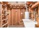 Unfinished basement with sink, water heater, wood framing and ladder for future finishing at 143 W Ray Rd, Chandler, AZ 85225