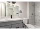 Modern bathroom with marble countertops and white tiled shower at 143 W Ray Rd, Chandler, AZ 85225