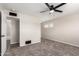 Spacious bedroom with carpet flooring and access to bathroom at 143 W Ray Rd, Chandler, AZ 85225