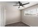 Comfortable bedroom with carpet, ceiling fan, and natural light from the window at 143 W Ray Rd, Chandler, AZ 85225