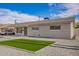 Inviting single-story home with desert-style landscaping and a covered parking area at 143 W Ray Rd, Chandler, AZ 85225