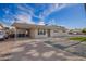 Charming single-story home featuring a covered carport and a low-maintenance desert landscape at 143 W Ray Rd, Chandler, AZ 85225