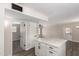 Open kitchen features quartz countertops, stainless steel appliances, and tile floors at 143 W Ray Rd, Chandler, AZ 85225
