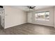 Spacious room featuring wood-look tile flooring and bright natural light at 143 W Ray Rd, Chandler, AZ 85225