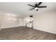 Inviting living room featuring wood-look tile flooring and an open floor plan at 143 W Ray Rd, Chandler, AZ 85225