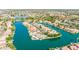 Aerial view of a waterfront community featuring beautiful homes, winding canals, and lush landscaping at 1502 E Treasure Cove Dr, Gilbert, AZ 85234