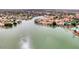 Aerial view of waterfront homes nestled along a serene lake and lush landscape at 1502 E Treasure Cove Dr, Gilbert, AZ 85234