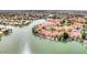 Stunning aerial view showcasing waterfront homes with boat docks on a picturesque lake at 1502 E Treasure Cove Dr, Gilbert, AZ 85234