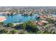 This aerial view shows the stunning lake, mature trees, and lush landscaping of the community at 1502 E Treasure Cove Dr, Gilbert, AZ 85234