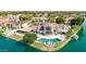 Stunning aerial view of an estate, showcasing the pool, backyard, and lake at 1502 E Treasure Cove Dr, Gilbert, AZ 85234