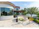 Stunning backyard showcasing a fire pit area with modern chairs overlooking a scenic waterfront at 1502 E Treasure Cove Dr, Gilbert, AZ 85234